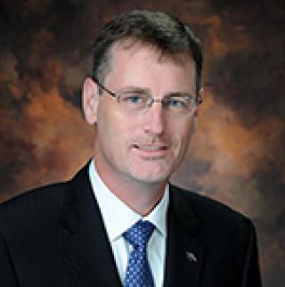 man in suit on brown background