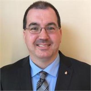 man in suit with glasses