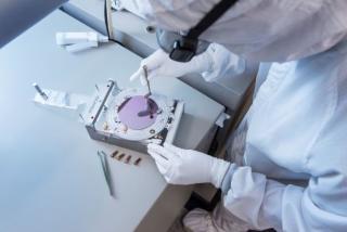 image of person working on a semiconductor