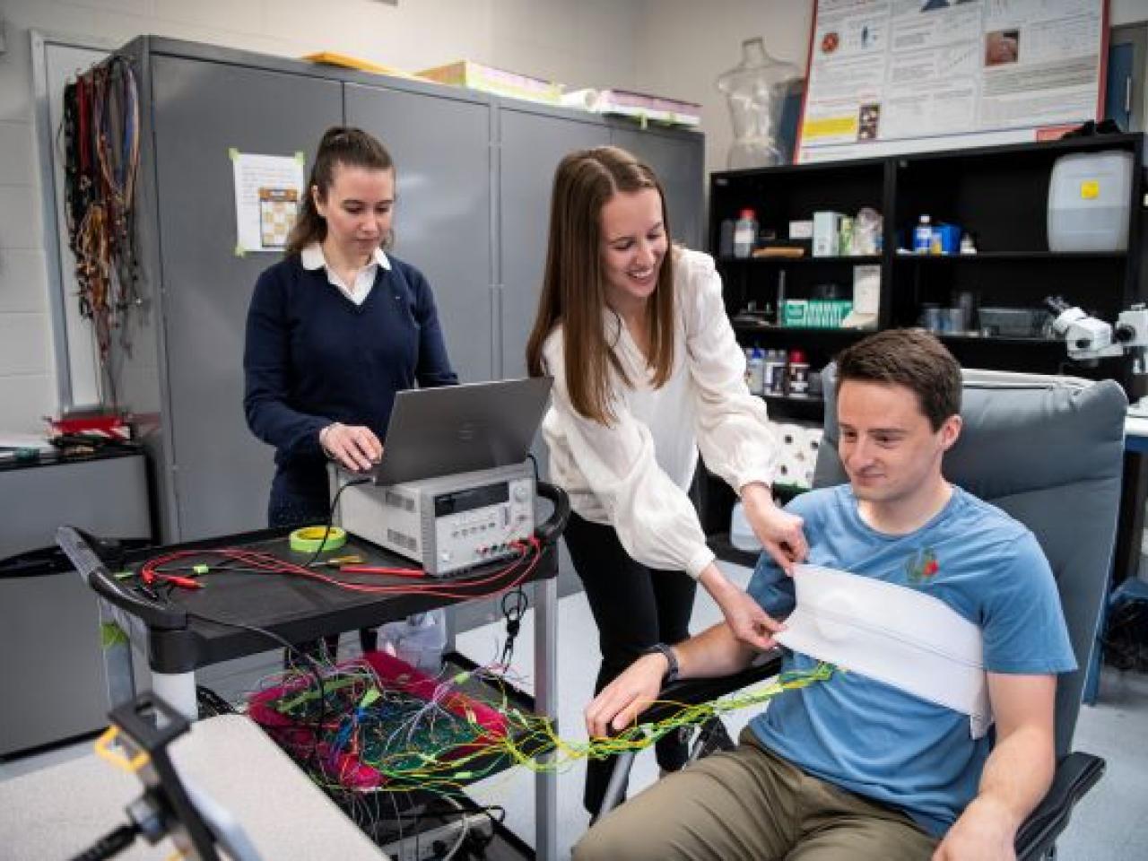 people in lab doing an experiment