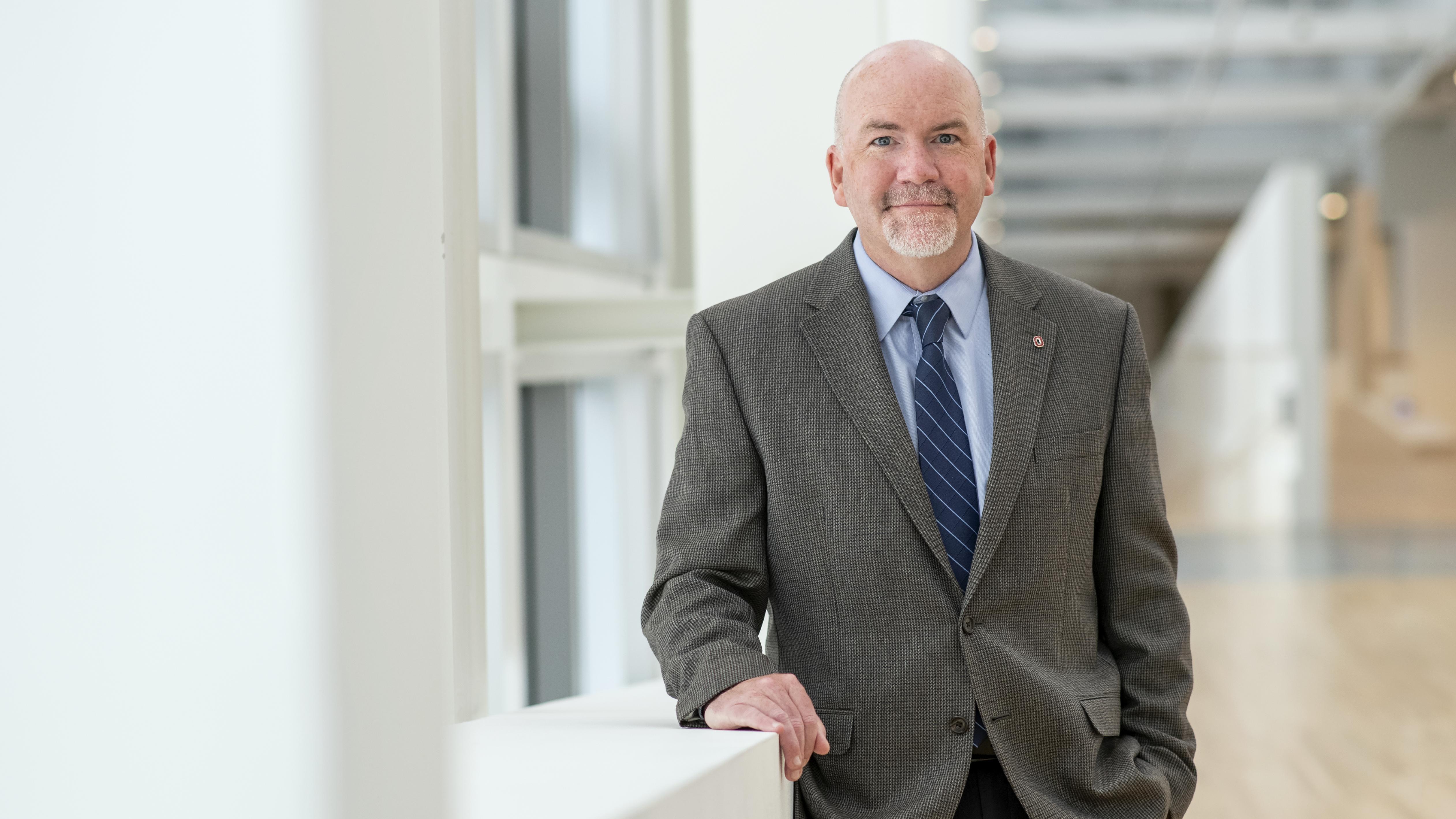 Standing head shot of Peter Mohler