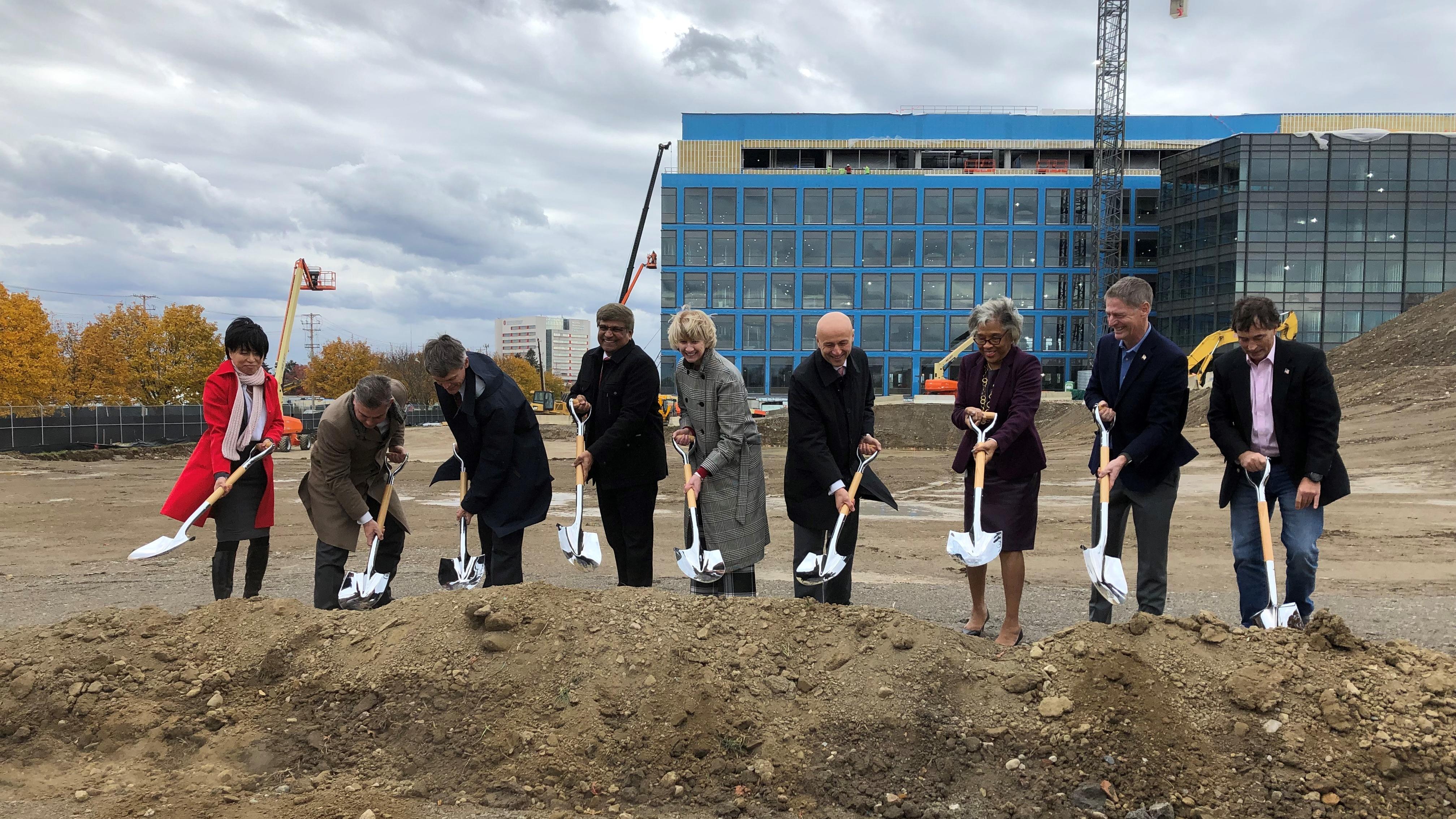 group of people participating in a groundbreaking