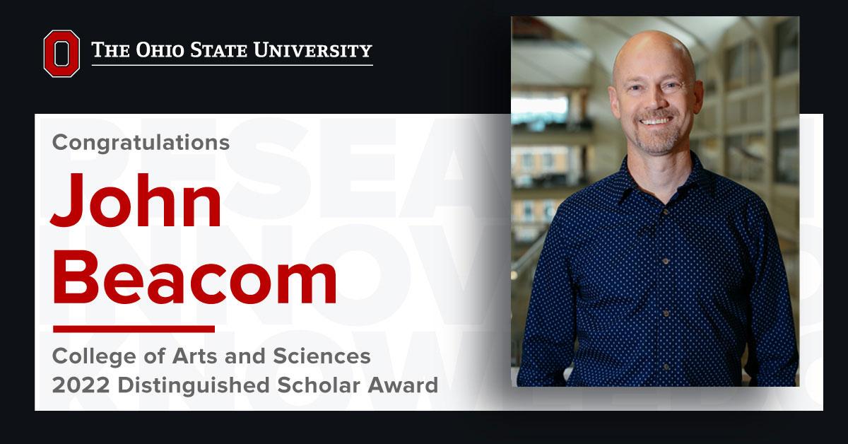 Image of John Beacom smiling with text overlay announcing 2022 Distinguish Scholar Award
