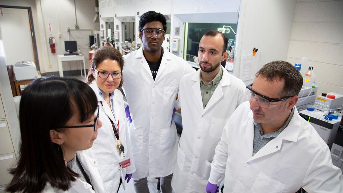 group in lab coats in the lab