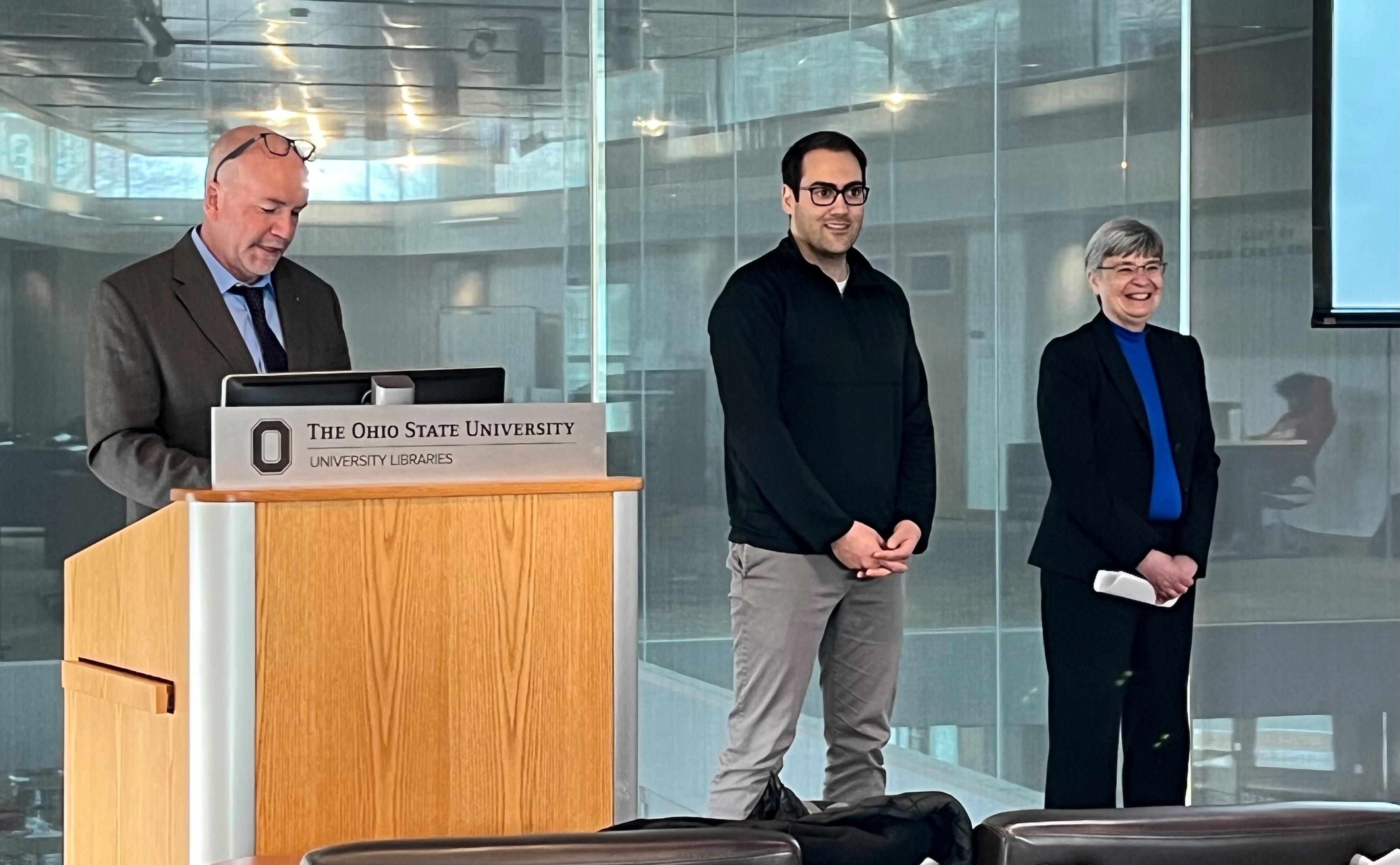 Peter Mohler, Christo Sevov and Susan Olesik standing at front of classroom