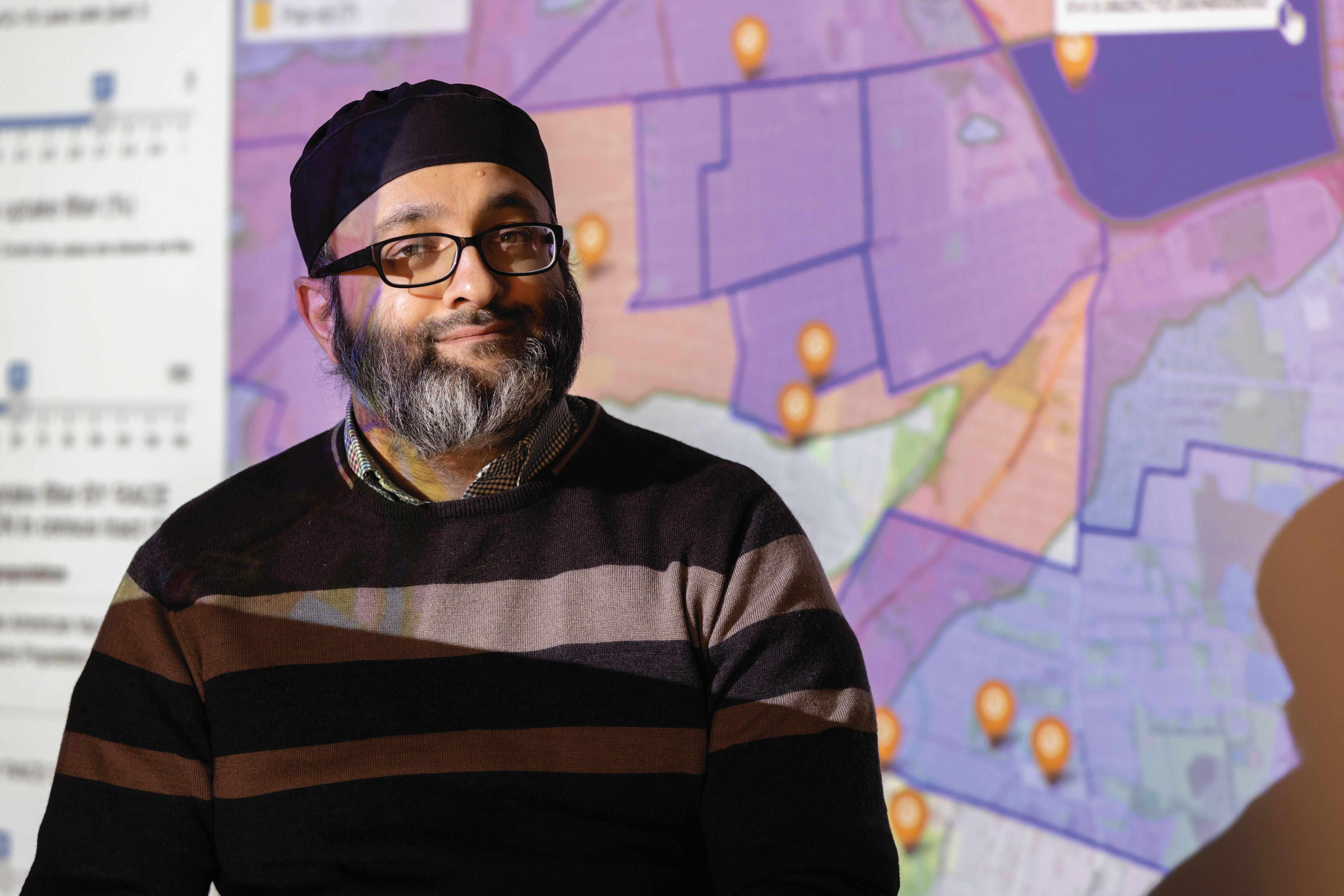 man standing in front of map