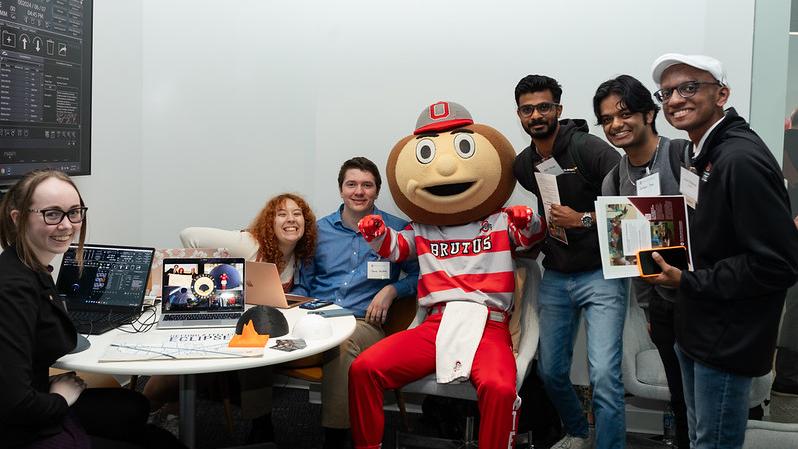 students gather around Brutus Buckeye in new center