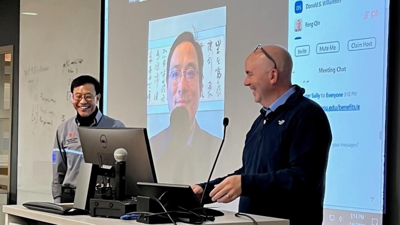 Dr. Mohler presenting award to Dr. Zhang