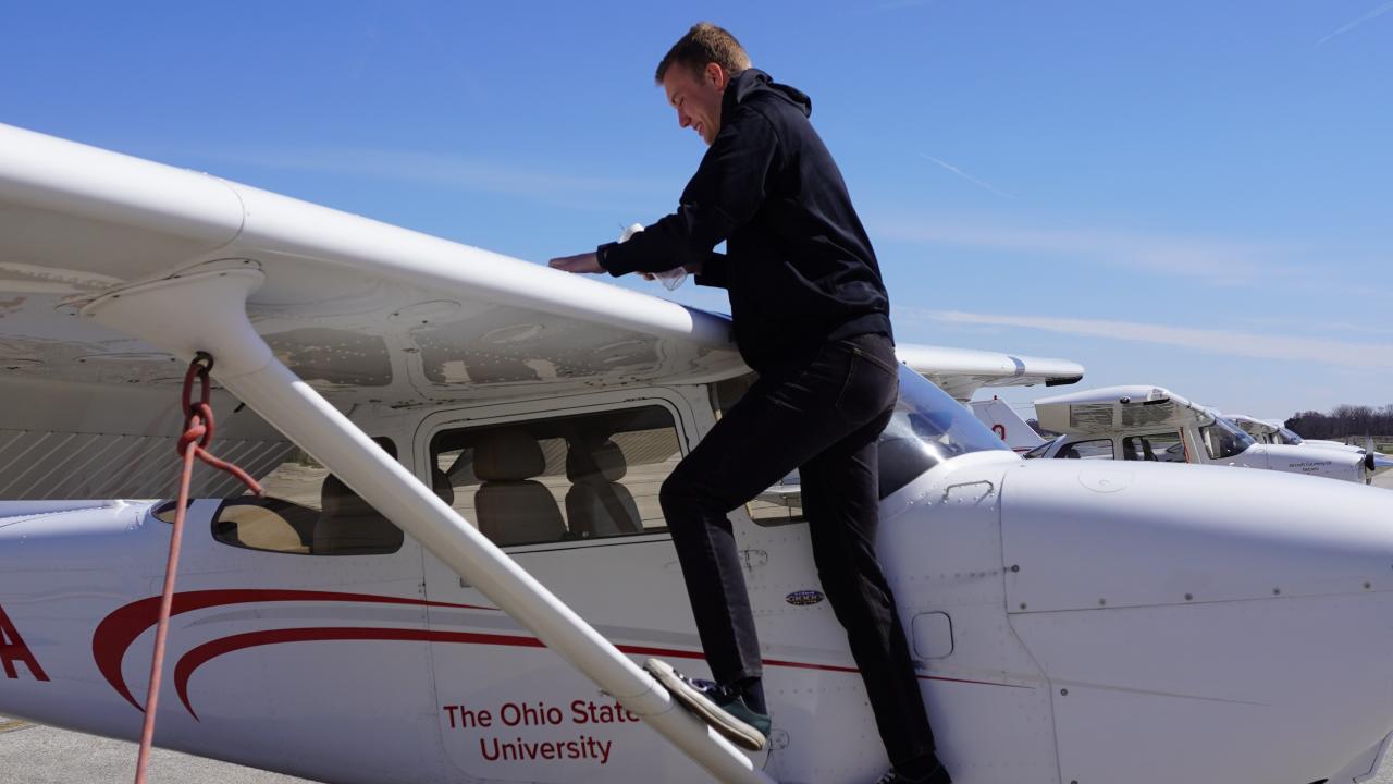 man boarding airplane