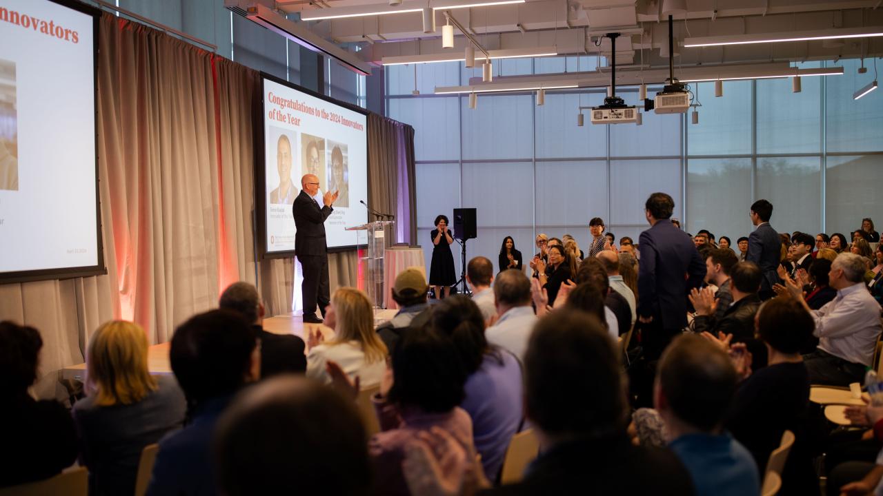 man standing in room on podium