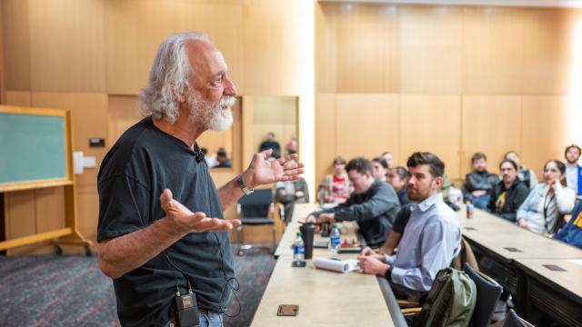 agostini delivers a lecture to a class