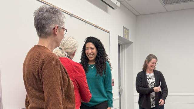 woman shaking another woman's hand